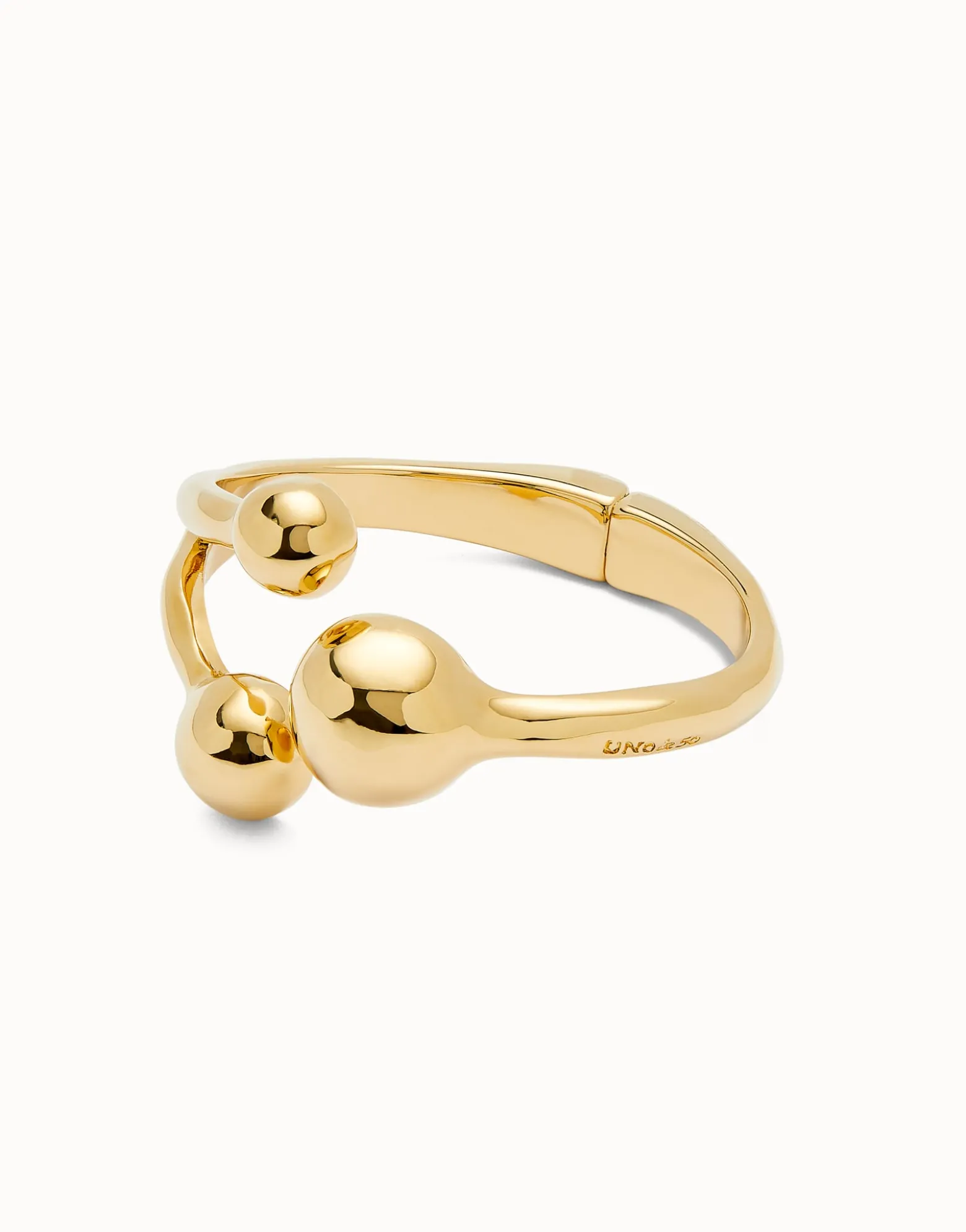 Pulsera rígida con tres bolas bañadas en oro 18k