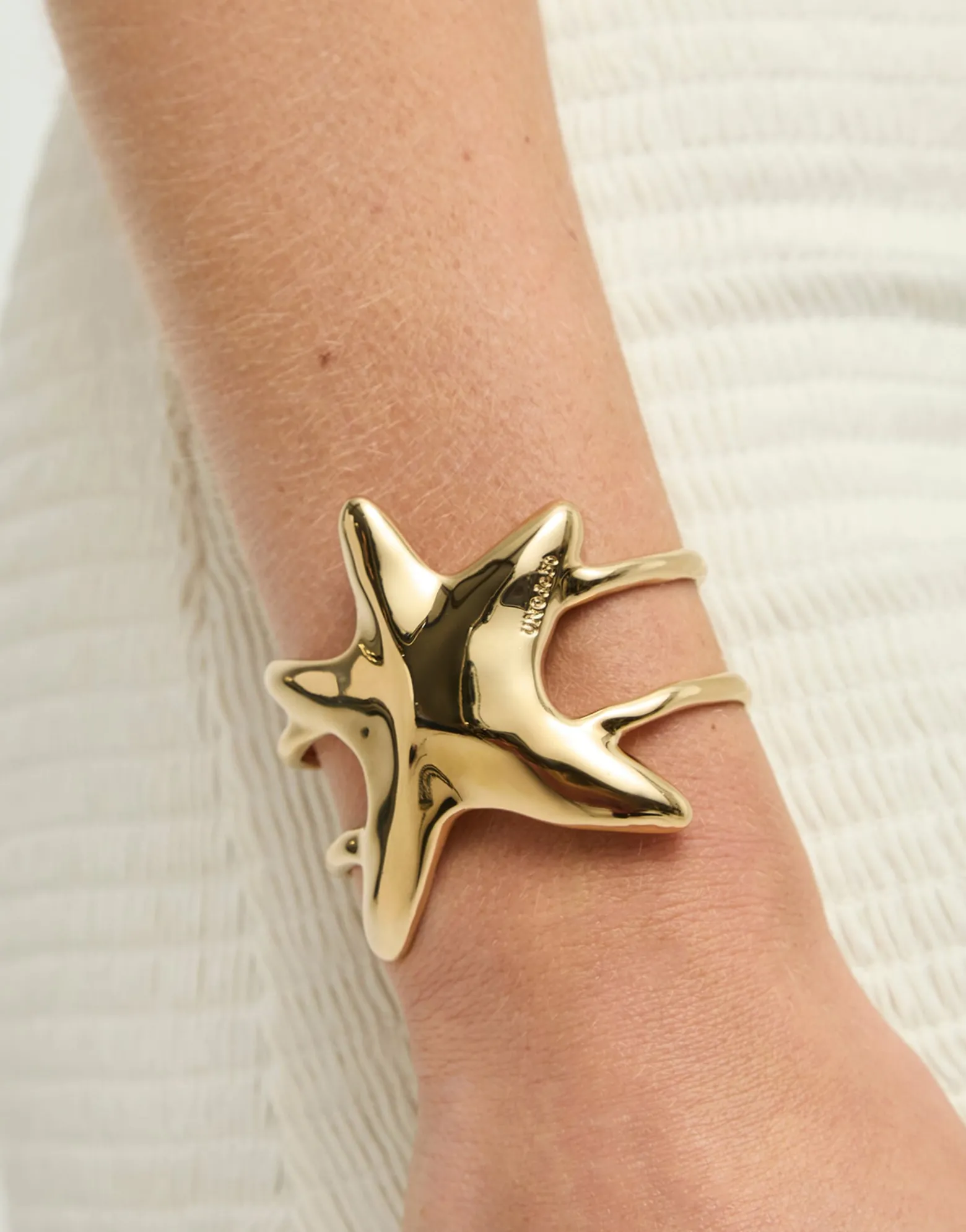 Pulsera rígida doble bañada en oro estrella de mar