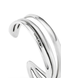 Pulsera rígida triple con curvas bañada en plata de ley
