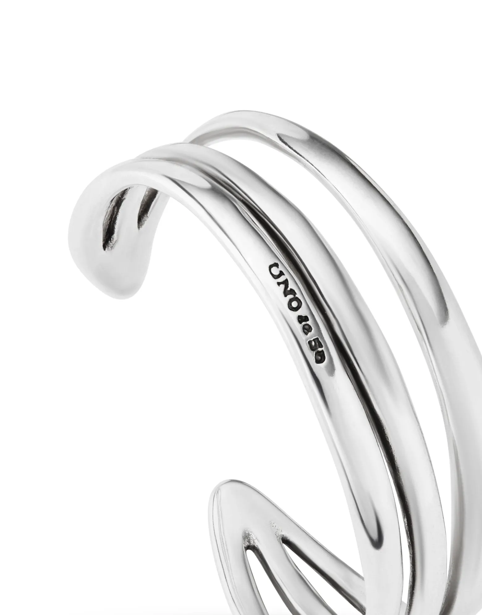 Pulsera rígida triple con curvas bañada en plata de ley