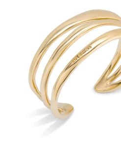 Pulsera rígida triple con curvas bañada en oro