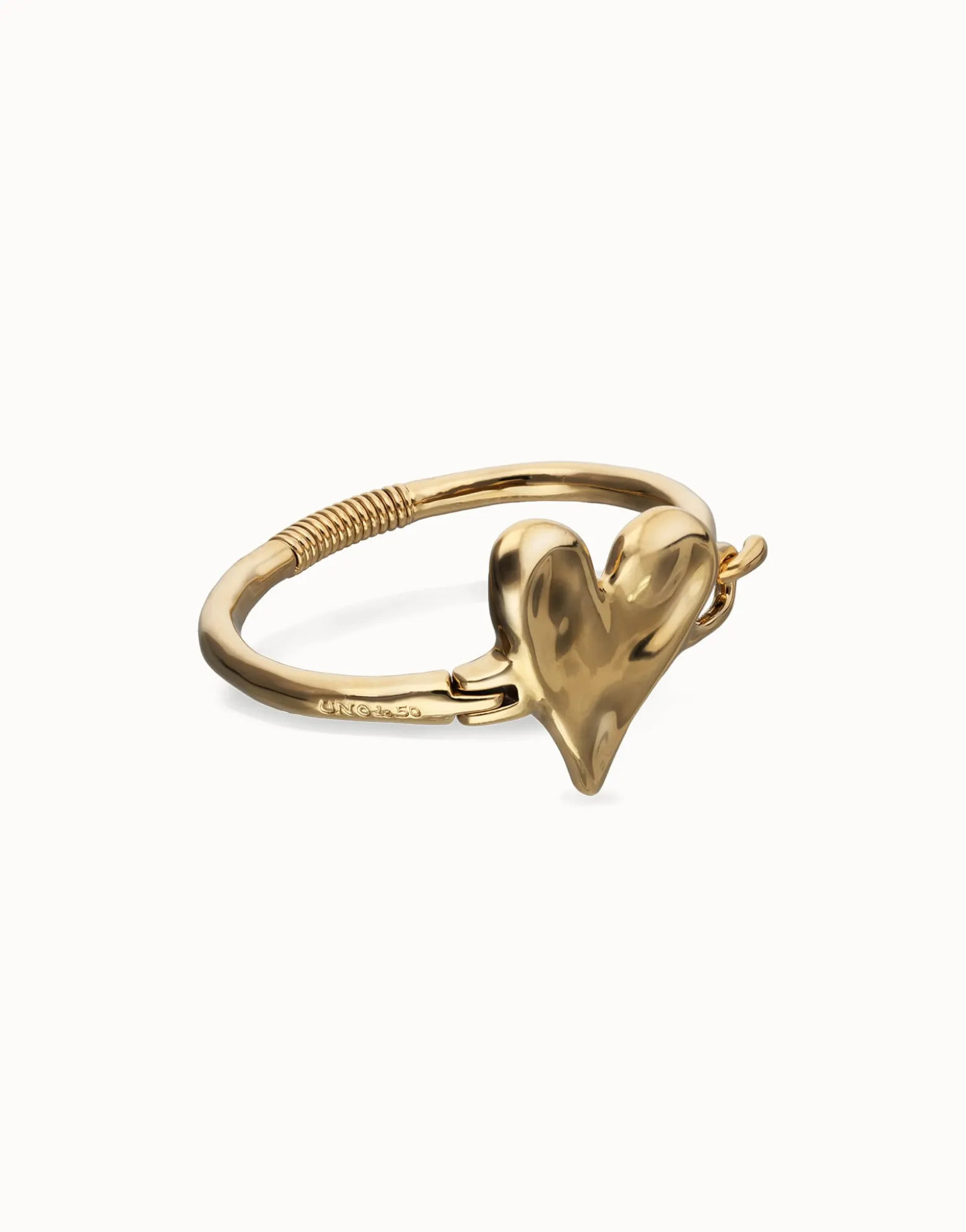 Pulsera semirrígida bañada en oro 18k y detalle de corazón